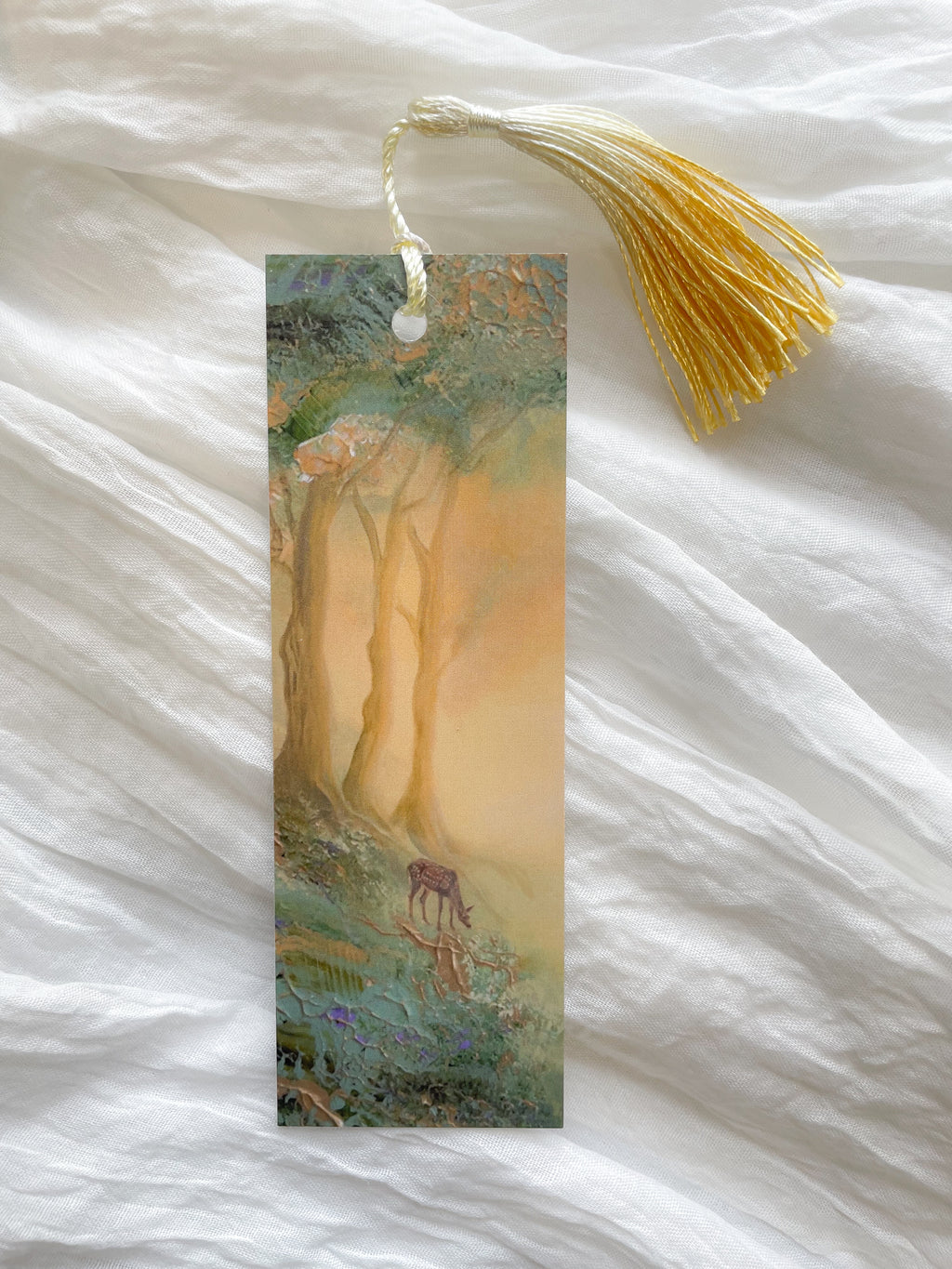 Front view of a fantasy-inspired art bookmark with a tassel.