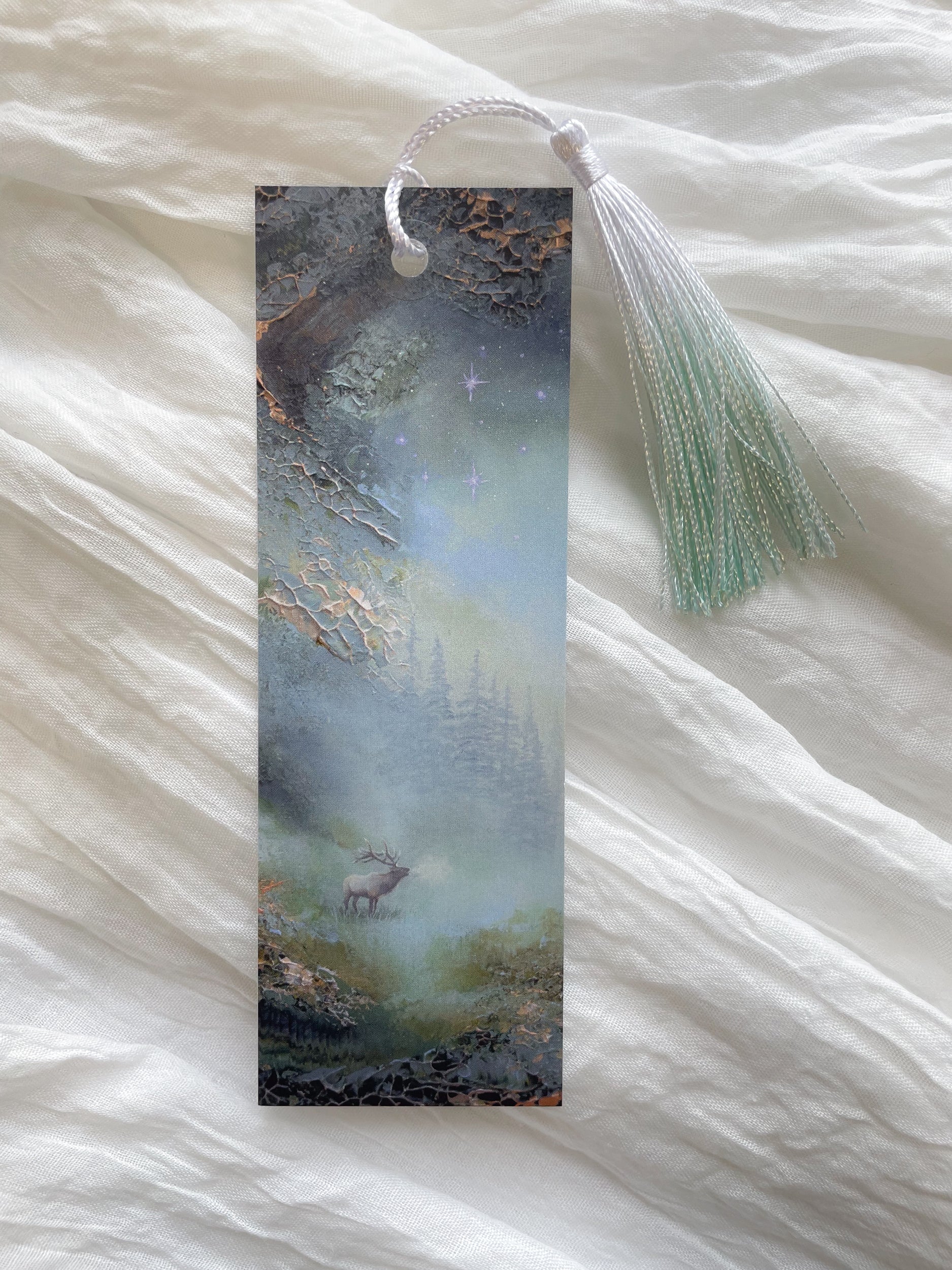 Front view of a fantasy-inspired art bookmark with a tassel.