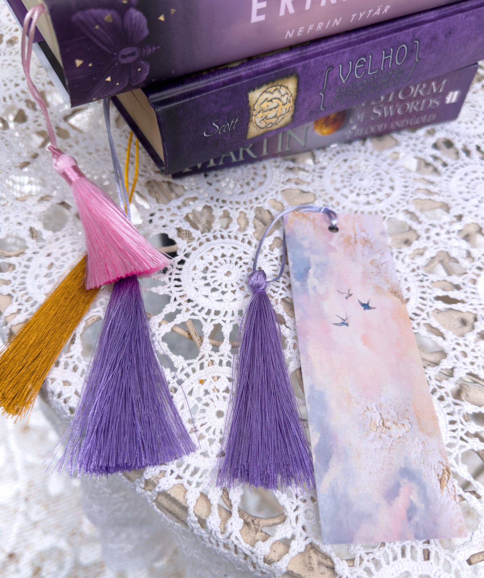 Fantasy-inspired art bookmarks displayed together in a cozy setting.