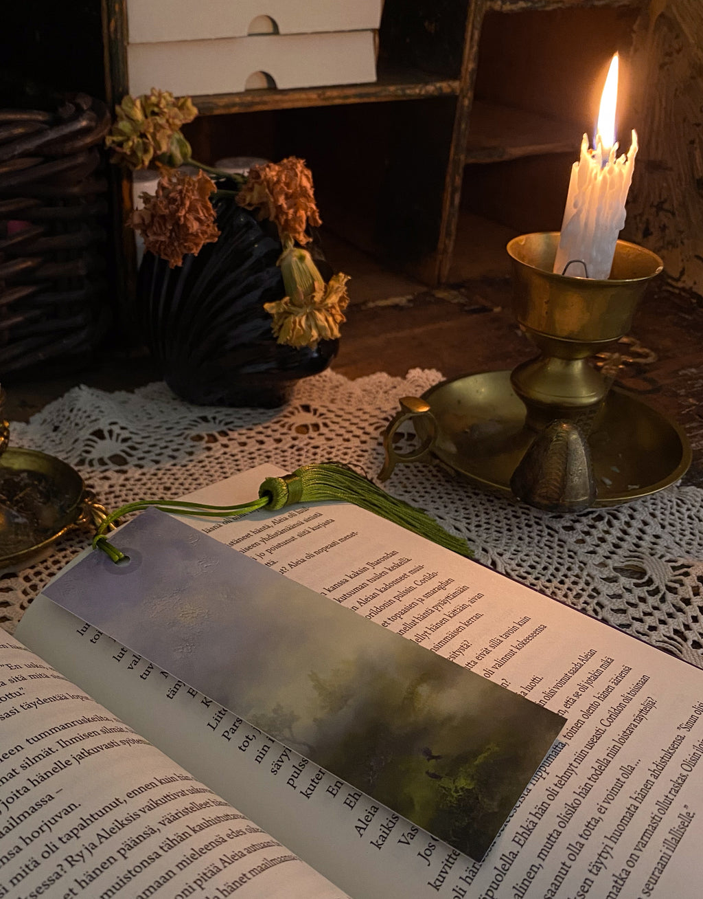 Fantasy-inspired art bookmarks displayed together in a cozy reading setting.