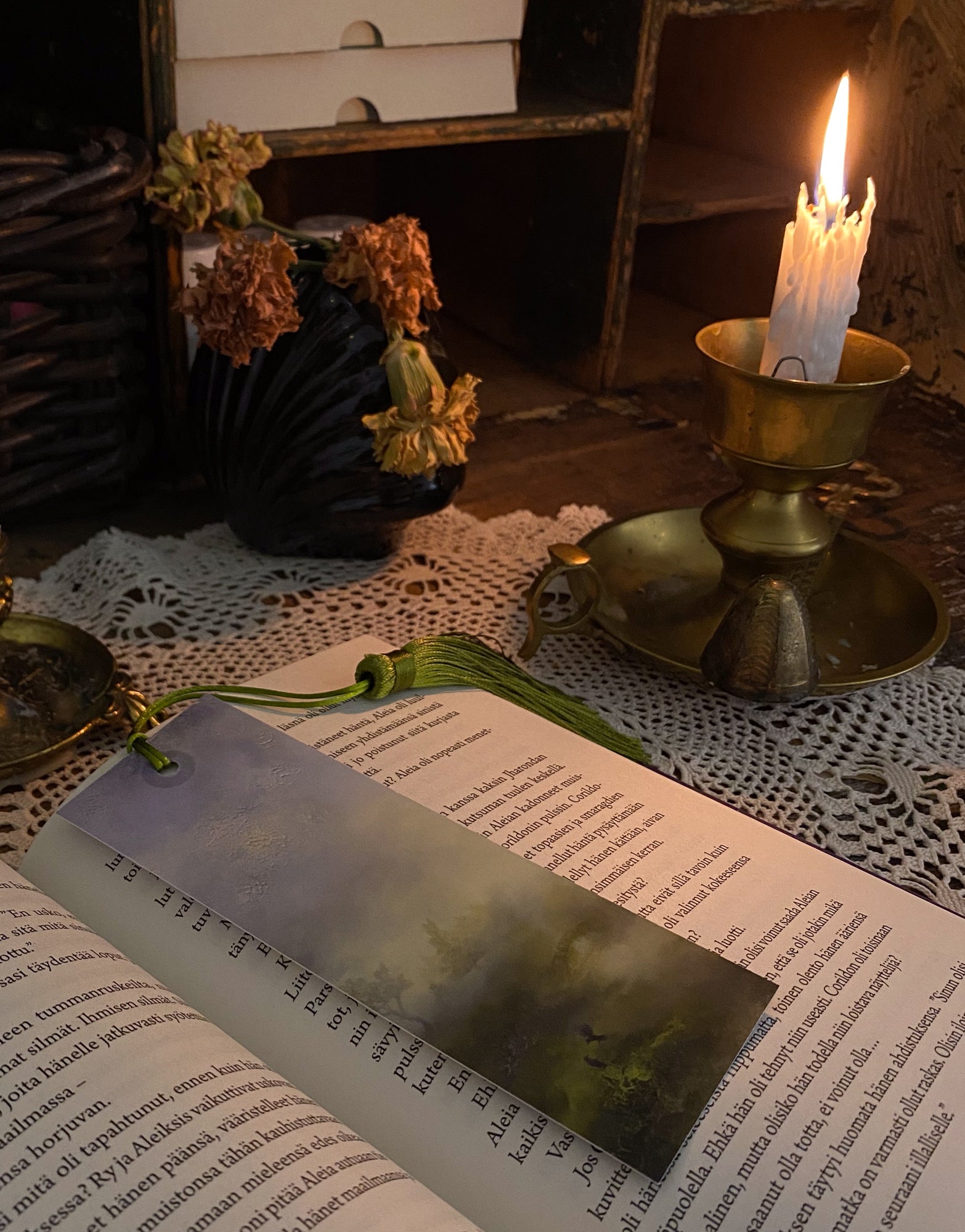 Fantasy-inspired art bookmarks displayed together in a cozy reading setting.