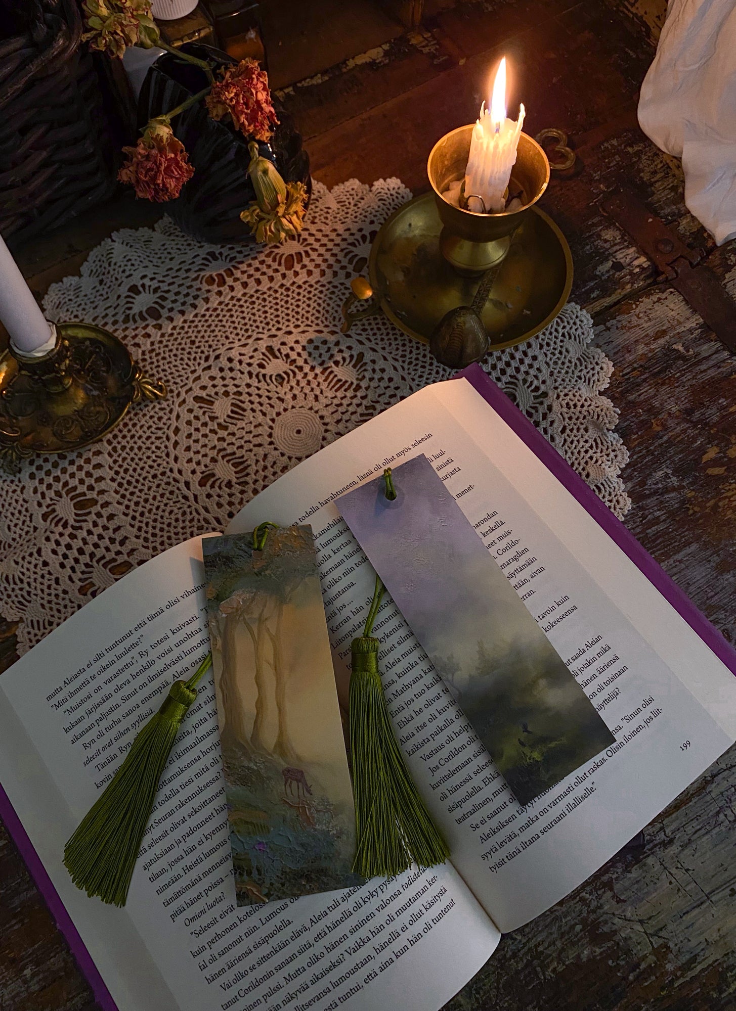 antasy-inspired art bookmarks displayed together in a cozy reading setting.
