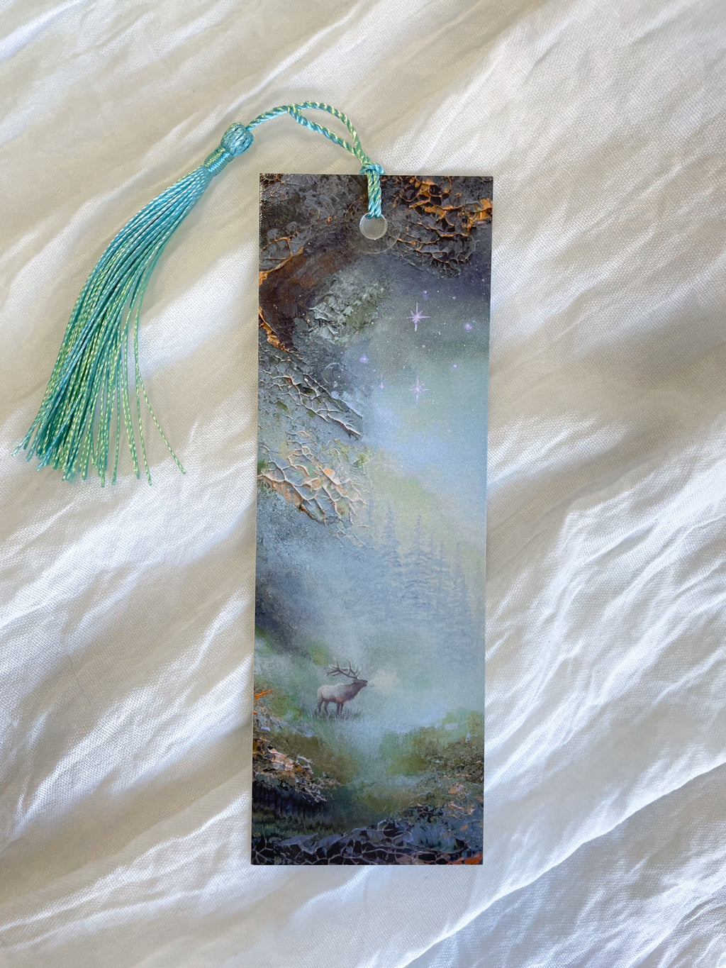 Front view of a fantasy-inspired art bookmark with a tassel.
