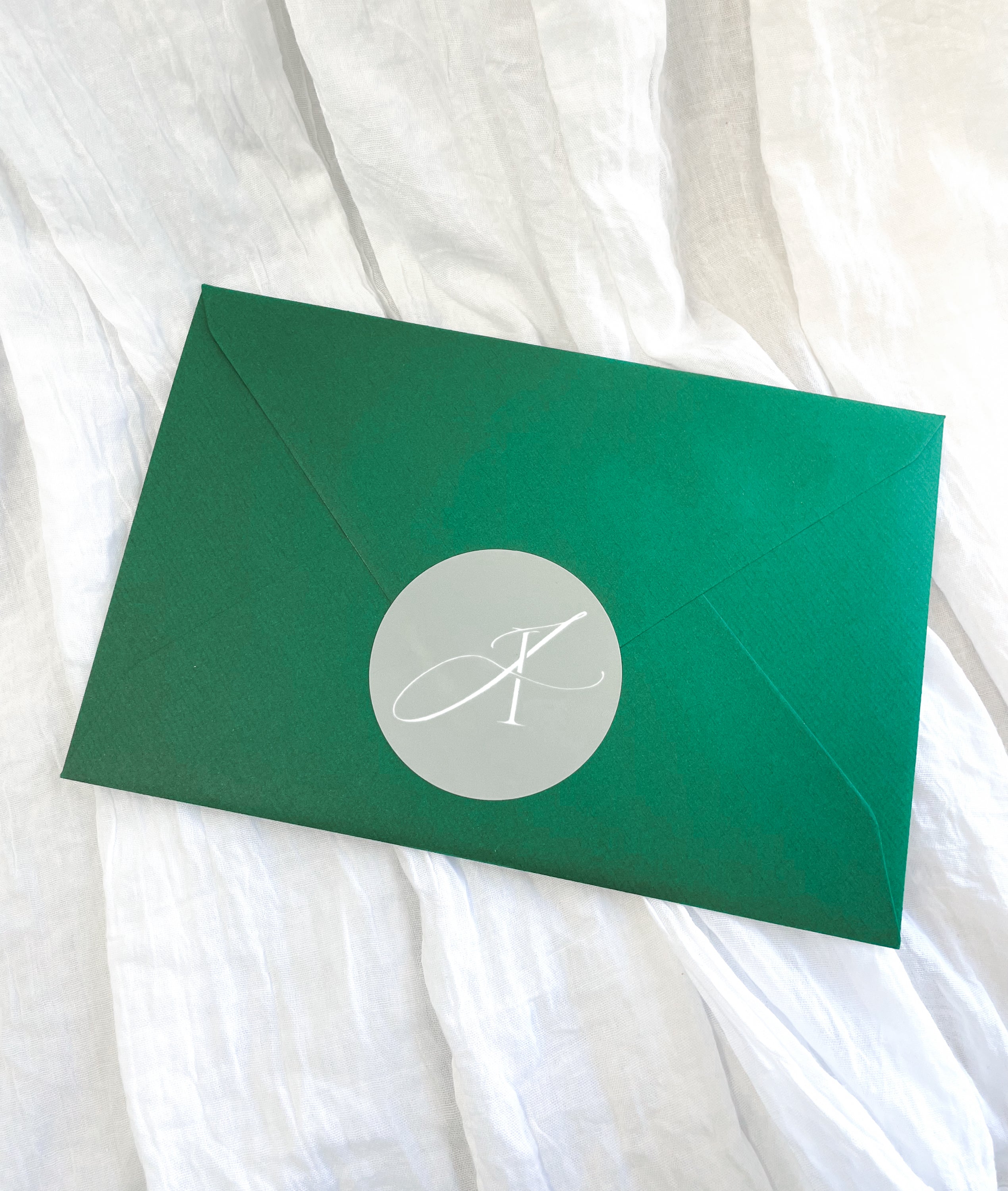 Green mystery envelope containing a surprise A5 fine art print.