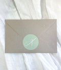 Natural kraft mystery envelope containing a surprise A5 fine art print and bookmark.