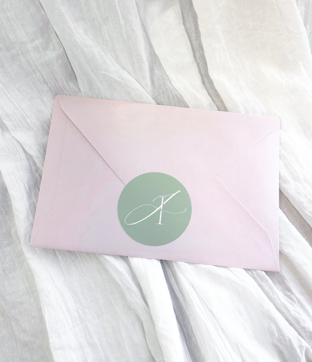 Pink mystery envelope containing a surprise A5 fine art print and bookmark.