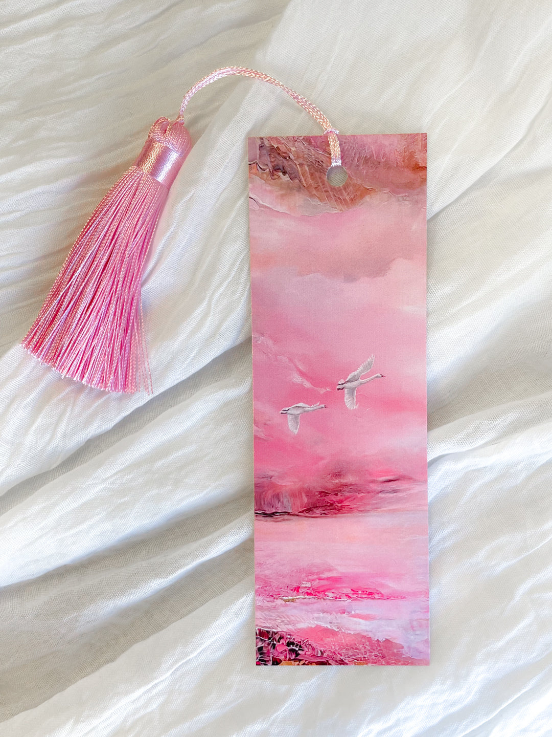 Fantasy-inspired art bookmark featuring a pastel landscape illustration.