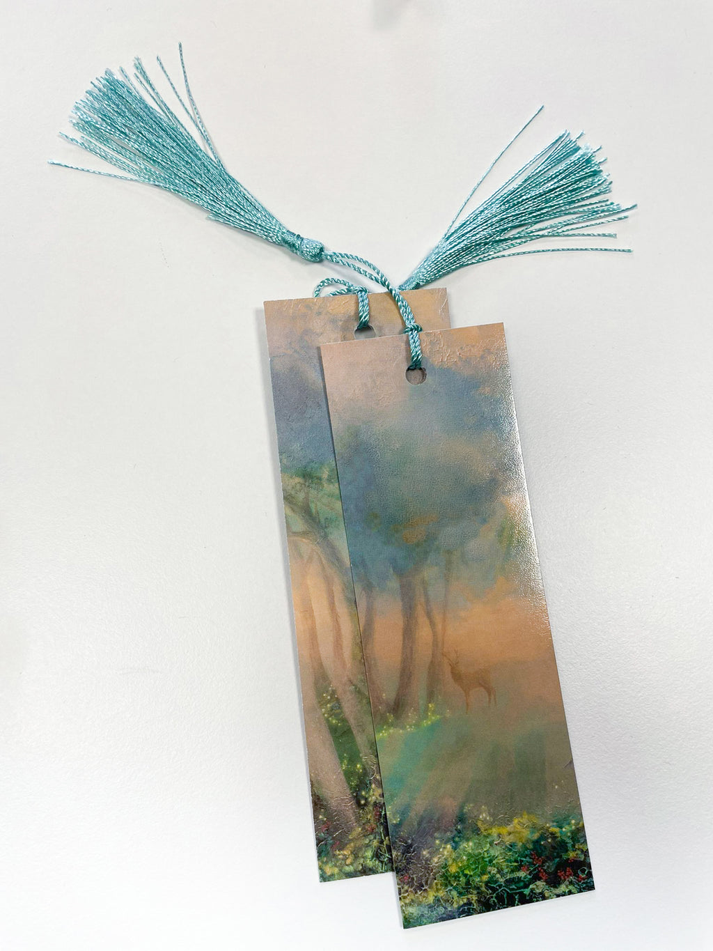 Fantasy-inspired art bookmarks displayed with a matching tassels.